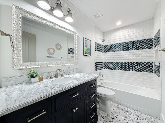 full bathroom with vanity, toilet, and tiled shower / bath combo