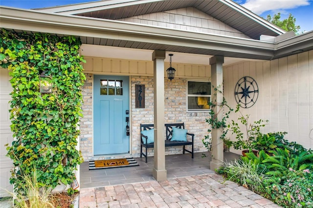 doorway to property featuring covered porch