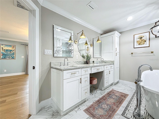 bathroom with hardwood / wood-style flooring, vanity, ornamental molding, and a bath