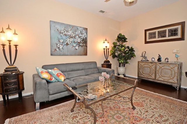 living room with dark hardwood / wood-style floors