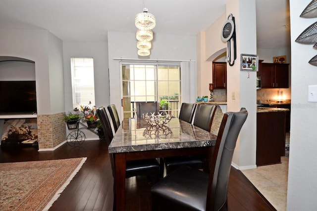 dining space featuring dark hardwood / wood-style floors