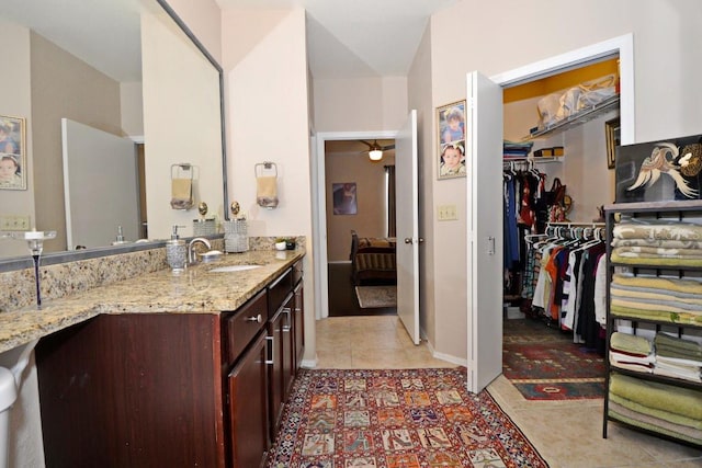 bathroom with tile patterned floors and vanity