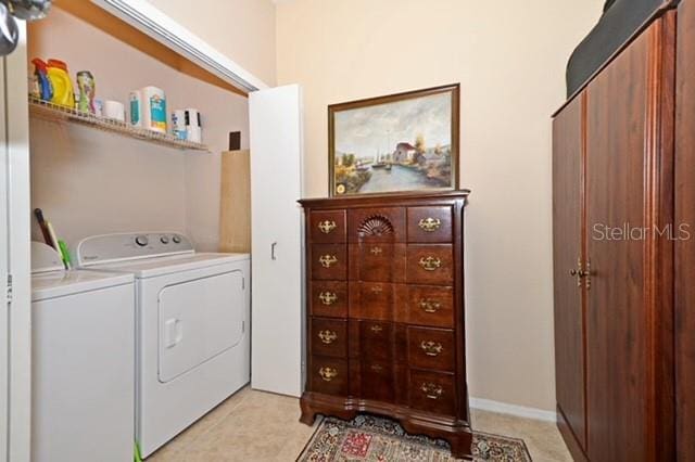 laundry area with washing machine and clothes dryer