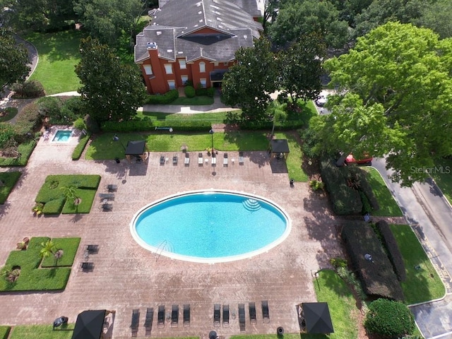 view of swimming pool featuring a patio