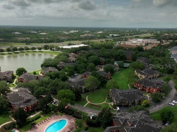 birds eye view of property with a water view