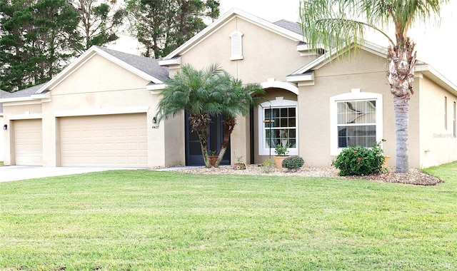 view of front of property featuring a front lawn and a garage