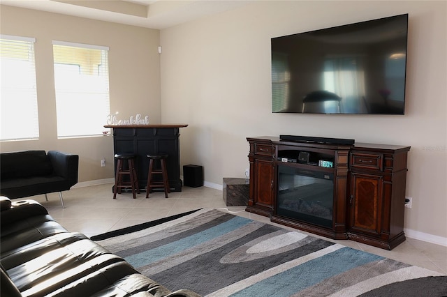 living room with bar and light tile patterned flooring