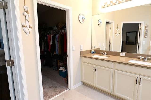 bathroom with tile patterned flooring and vanity