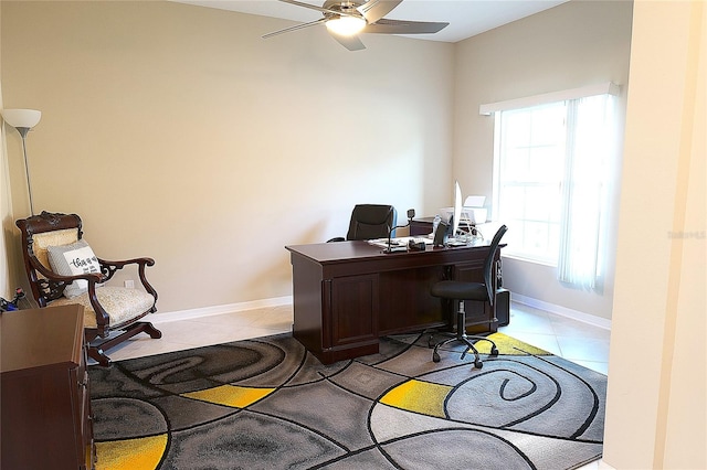 tiled office featuring ceiling fan