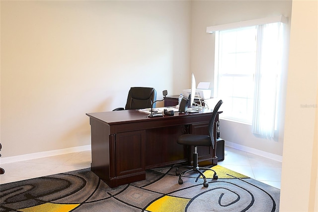 tiled home office featuring a wealth of natural light