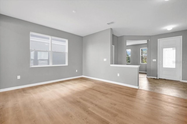 unfurnished living room featuring light wood-type flooring