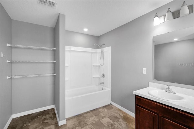 bathroom with bathtub / shower combination and vanity