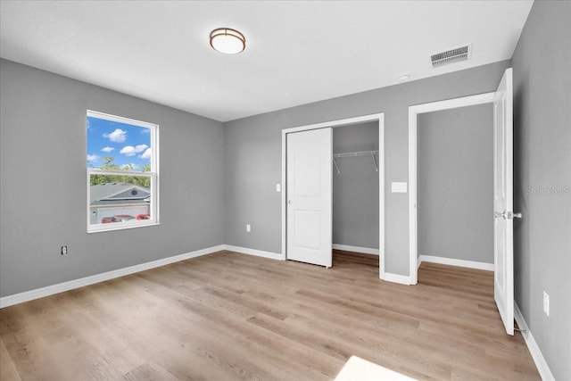 unfurnished bedroom featuring light wood-type flooring