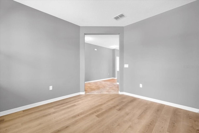 unfurnished room featuring light hardwood / wood-style flooring