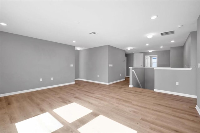 spare room with light hardwood / wood-style floors