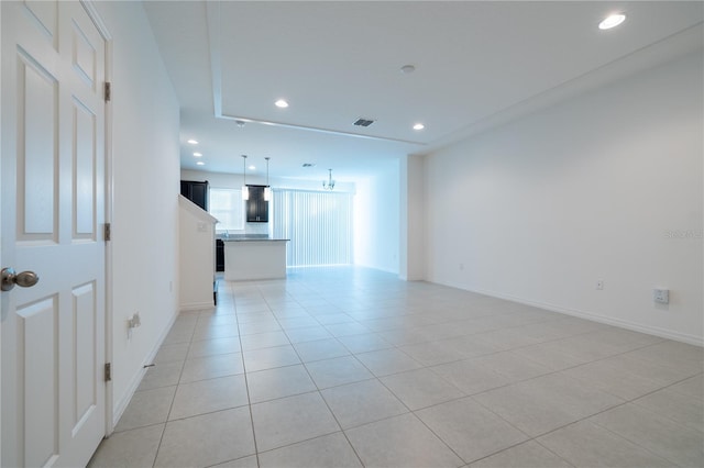 unfurnished living room with light tile patterned flooring