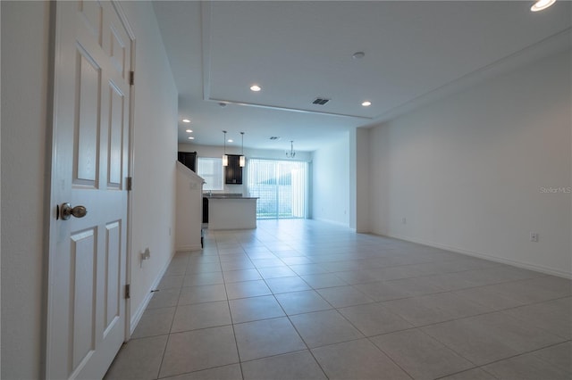 unfurnished living room featuring light tile patterned floors