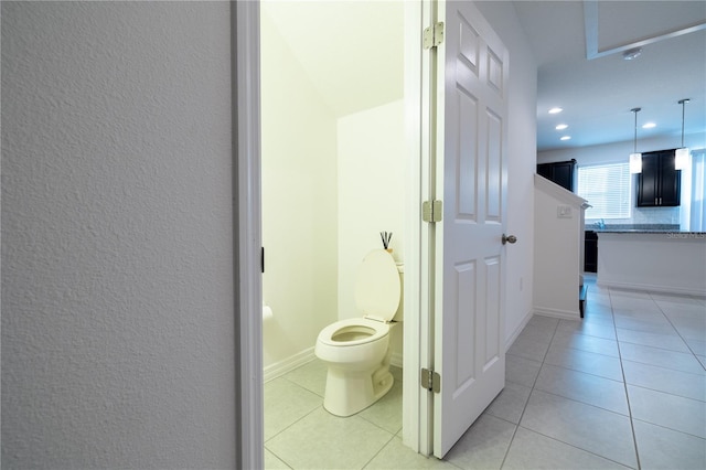 hallway featuring light tile patterned floors