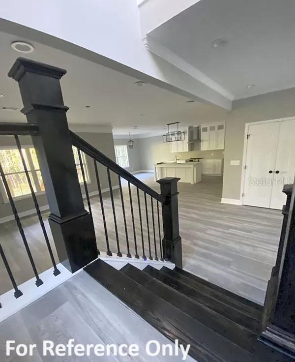 stairway featuring hardwood / wood-style flooring