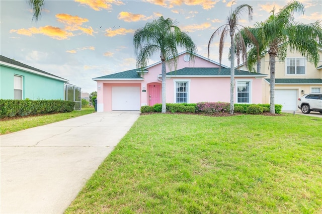 view of front of home featuring a garage and a front yard