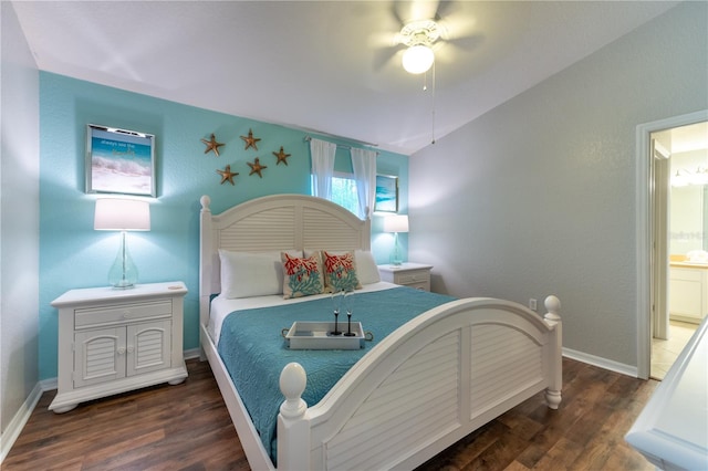 bedroom featuring lofted ceiling, connected bathroom, ceiling fan, and dark hardwood / wood-style floors