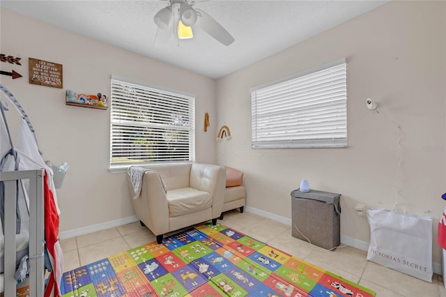 game room featuring light tile patterned floors and a wealth of natural light