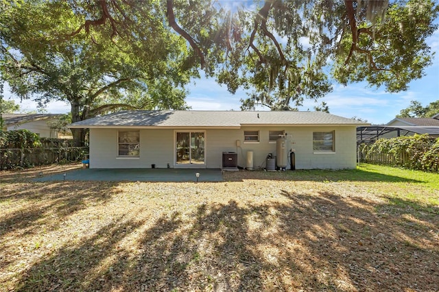 rear view of property with a patio area and cooling unit