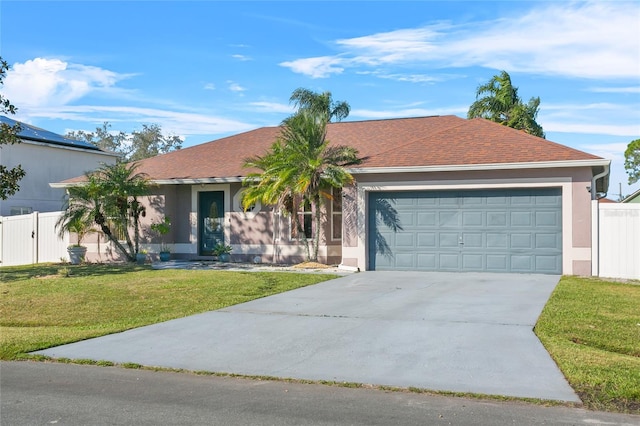 single story home featuring a front yard and a garage