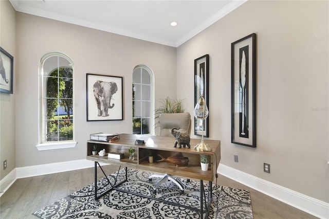 home office with crown molding, baseboards, and wood finished floors