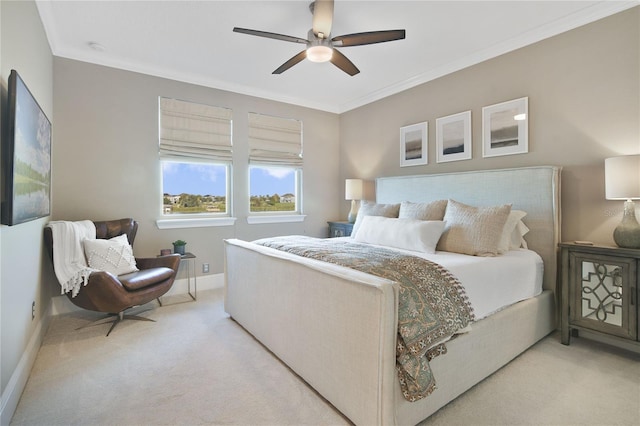 bedroom featuring light carpet, a ceiling fan, baseboards, and crown molding