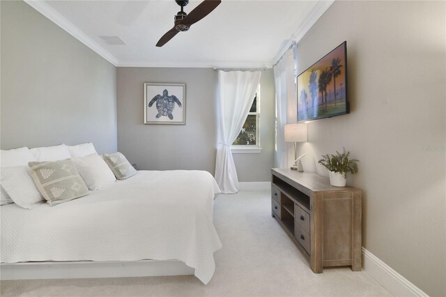 bedroom featuring visible vents, ornamental molding, light carpet, ceiling fan, and baseboards