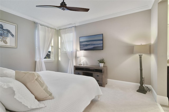 bedroom with light carpet, a ceiling fan, baseboards, and crown molding