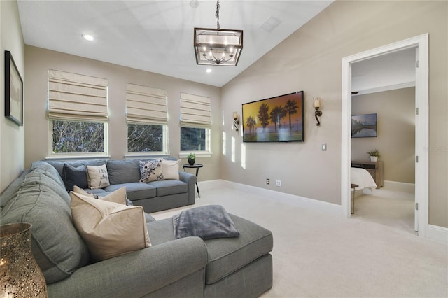 carpeted living room with a healthy amount of sunlight, baseboards, a chandelier, and recessed lighting