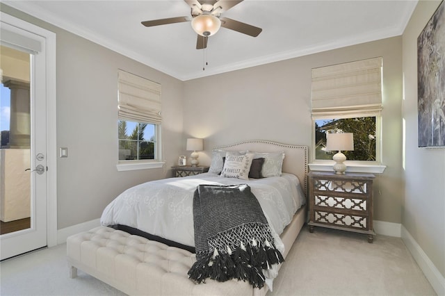 bedroom with carpet floors, baseboards, a ceiling fan, and ornamental molding