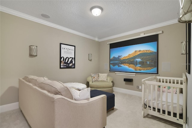 home theater room with carpet, a textured ceiling, baseboards, and crown molding