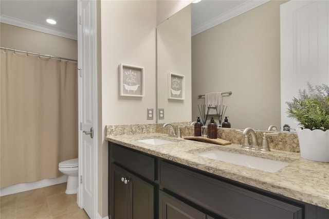 full bath featuring double vanity, a sink, toilet, and crown molding