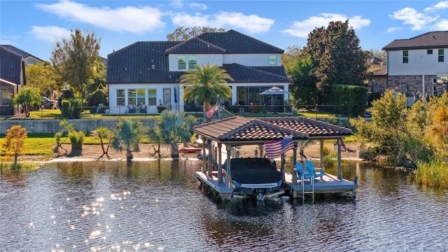 dock area with a water view and boat lift