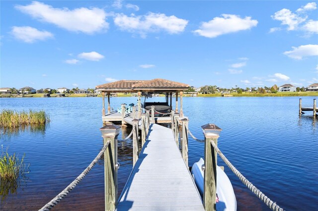 dock area featuring a water view and boat lift