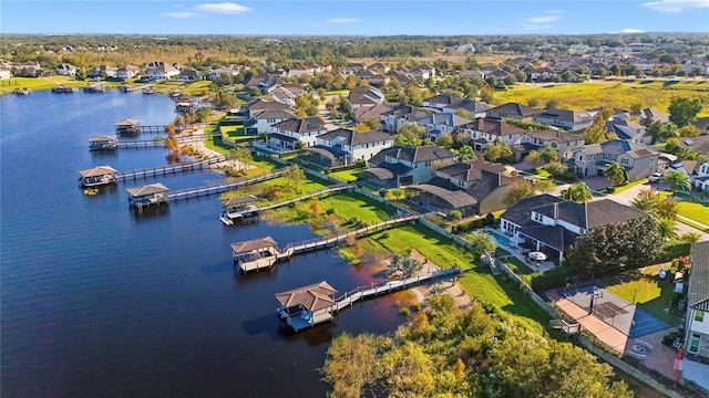 birds eye view of property featuring a residential view and a water view