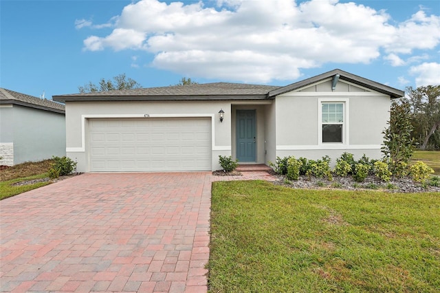 ranch-style house with a front lawn and a garage