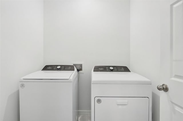 clothes washing area with washer and dryer