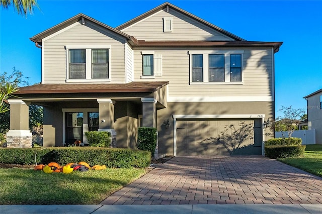 view of front facade featuring a porch and a garage