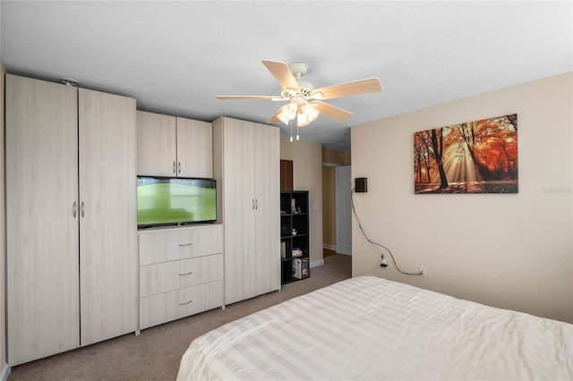 carpeted bedroom featuring ceiling fan