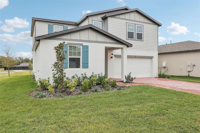 view of front facade with a garage and a front lawn