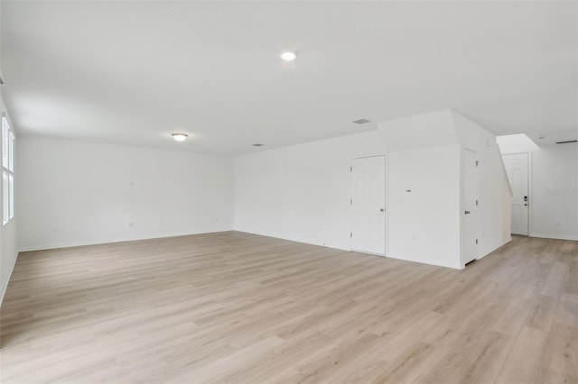 spare room featuring light hardwood / wood-style floors