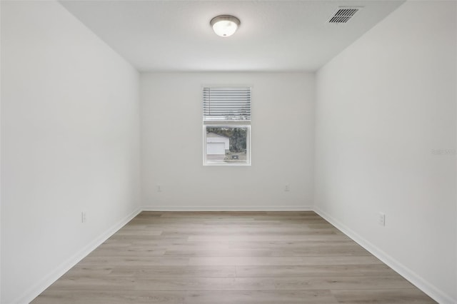 spare room featuring light hardwood / wood-style floors