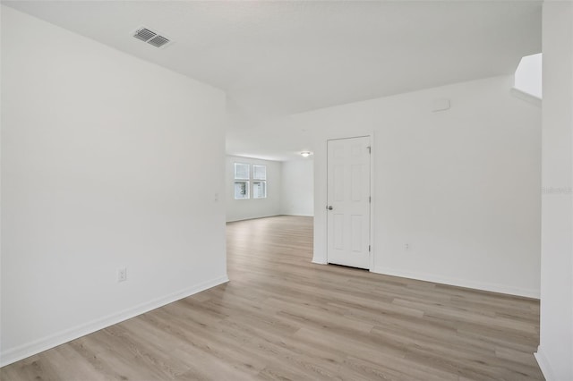 spare room featuring light wood-type flooring