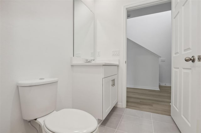 bathroom with tile patterned floors, vanity, and toilet