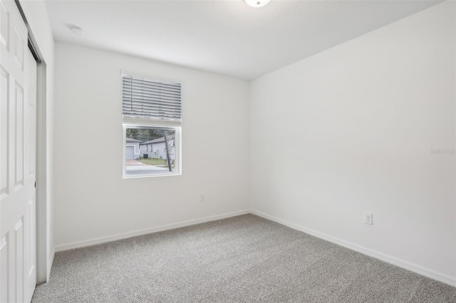 spare room featuring carpet flooring