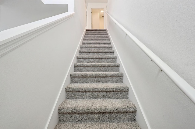 stairway with carpet flooring